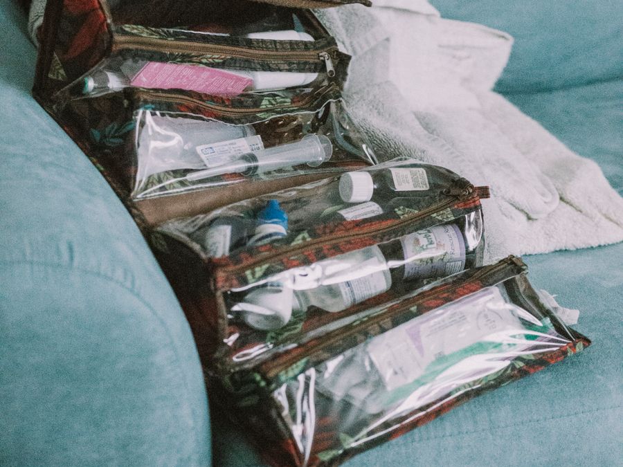 Clear plastic toiletry bags holding small bottles